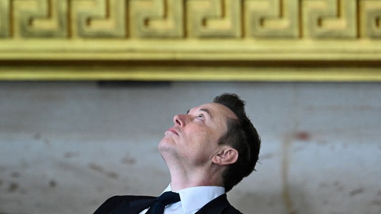 Tesla and SpaceX CEO Elon Musk looks upward as he sits in his seat during inauguration ceremony before Donald Trump is sworn in as the 47th US President in the US Capitol Rotunda in Washington, DC, on January 20, 2025.     SAUL LOEB/Pool via REUTERS