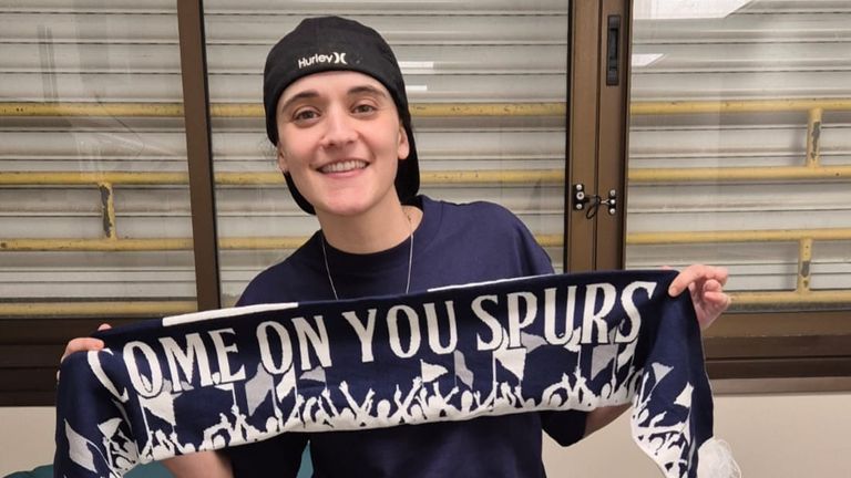 Emily Damari, who was freed after being a hostage of Hamas for 15 months in Gaza, holding a Tottenham Hotspur scarf.
Pic: Family Handout/PA