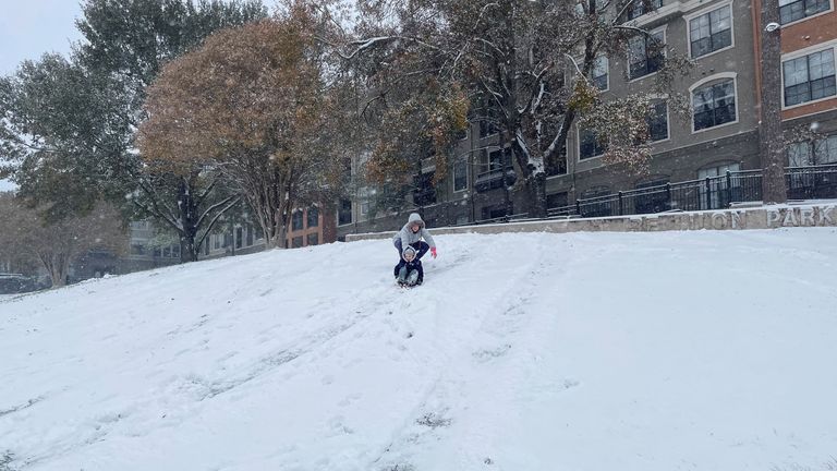 Kids play in the snow in Houston, Texas, as winter storm Enzo covers the city in snow, U.S., January 21, 2025. REUTERS/Arathy Somasekhar

