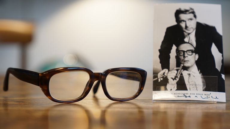 A pair of Eric Morecambe's glasses have fetched £20,000 at auction