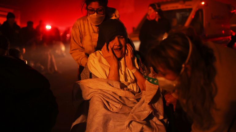 A resident of a senior centre is evacuated as the Eaton Fire approaches.
Pic: AP