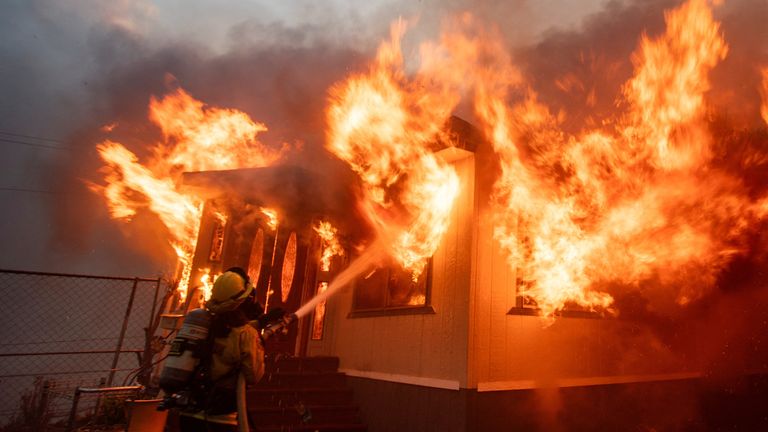 A firefighter faces the Palisades Fire during a windstorm on the west side of Los Angeles.
Pic: Reuters