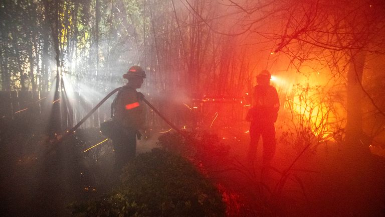 Firefighters confront the Eaton fire as it blazes in Sierra Madre, east side of Los Angeles.
Pic: Ringo Chiu/AP
