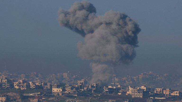 Smoke billows as buildings lie in ruin in Beit Hanoun in the Gaza Strip.
Pic: Reuters