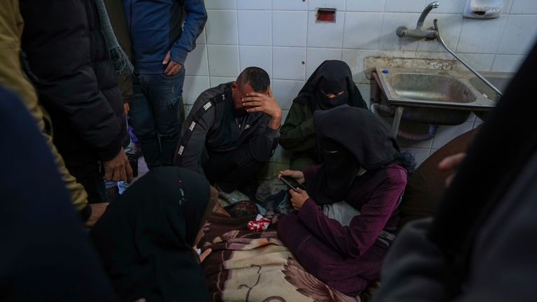 Relatives mourn after someone was killed in an Israeli bombardment of the al Aqsa Hospital.
Pic: AP/Abdel Kareem Hana