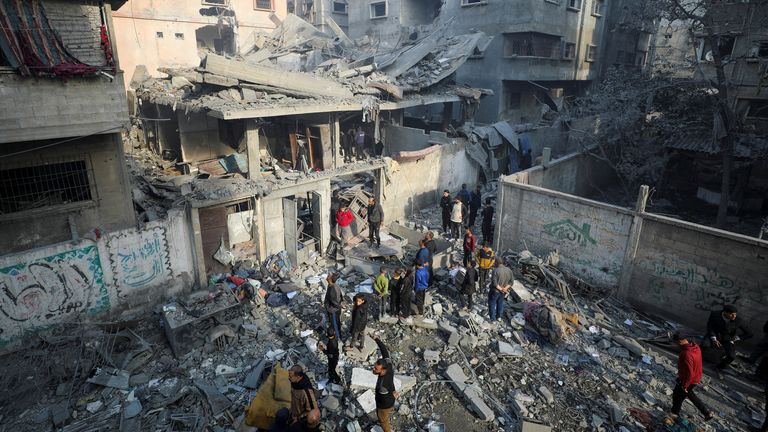 Palestinians gather at the site of an Israeli strike on a house, amid the ongoing conflict between Israel and Hamas, in Gaza City, January 5, 2025. REUTERS/Dawoud Abu Alkas