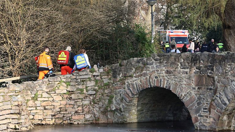 Rescue and security worker are seen near a crime scene in Aschaffenburg, Germany.
Pic: DPA/AP