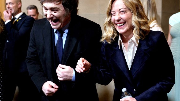 Italian Prime Minister Giorgia Meloni and Argentina's President Javier Milei share a joke as they arrive for the Presidential Inauguration of Donald Trump at the Rotunda of the U.S. Capitol in Washington, U.S. January 20, 2025. REUTERS/Evelyn Hockstein     TPX IMAGES OF THE DAY     