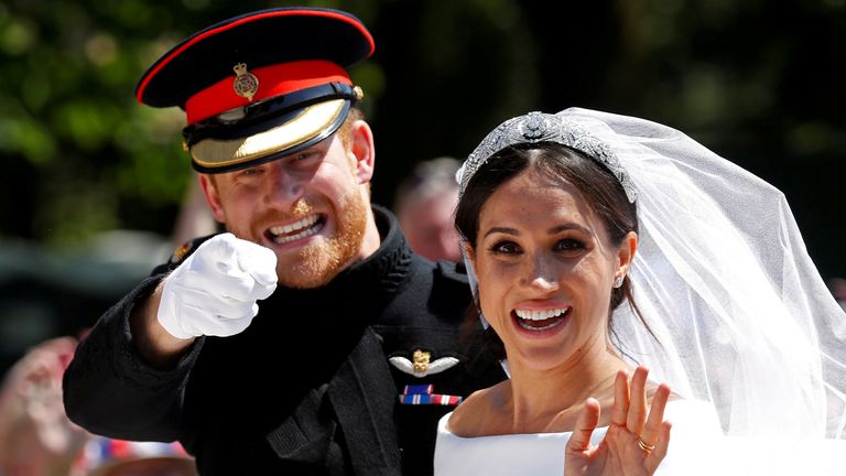 Britain's Prince Harry gestures next to his wife Meghan as they ride a horse-drawn carriage after their wedding ceremony at St George's Chapel in Windsor Castle in Windsor, Britain, May 19, 2018. Picture taken May 19, 2018. REUTERS/Damir Sagolj/File Photo SEARCH "POY DECADE" FOR THIS STORY. SEARCH "REUTERS POY" FOR ALL BEST OF 2019 PACKAGES. TPX IMAGES OF THE DAY.