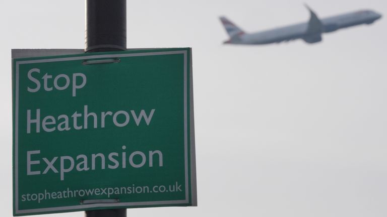 A plane flies past a "Stop Heathrow Expansion" sign on Zealand Avenue in Harmondsworth, west London, one of the villages which would be affected by the expansion of Heathrow Airport. Expanding Heathrow Airport would be "catastrophic", environmental groups have claimed, amid reports that the Chancellor of the Exchequer Rachel Reeves is preparing to back the project for the proposed third runway at the west London airport and endorse expansion at Gatwick and Luton Airports. Picture date: Tuesday J