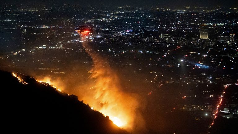 Water is dropped by helicopter on the burning Sunset Fire in the Hollywood Hills.
Pic: AP