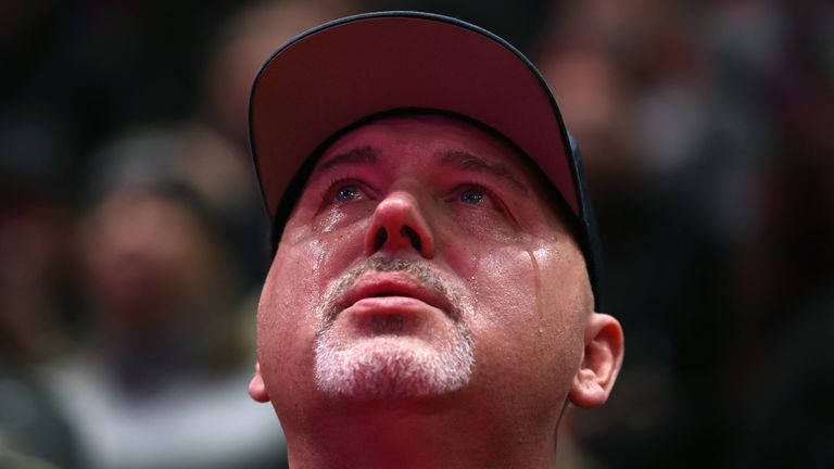 An attendee cries inside Capital One arena on the inauguration day of Donald Trump.
Pic: Reuters