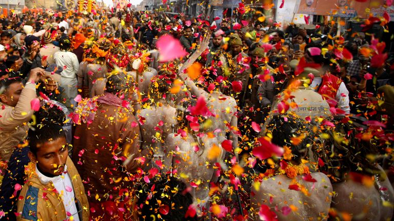 Naga Sadhus are showered with petals at they arrive at this year's festival.
Pic: Reuters/Ritesh Shukla