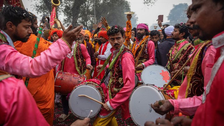 Members of a band perform while arriving ahead of the festival. Pic: Reuters