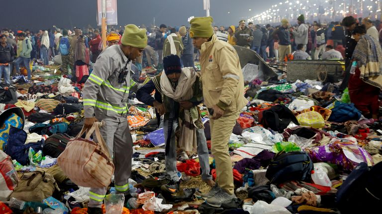 Security personnel assist a person after a stampede before the second "Shahi Snan" (grand bath) at the "Kumbh Mela" or the Pitcher Festival, in Prayagraj, previously known as Allahabad, India, January 29, 2025. REUTERS/Sharafat Ali