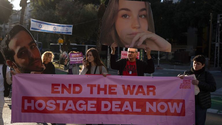 Relatives and supporters of Israeli hostages held by Hamas in Gaza hold photos of their loved ones during a protest calling for their return, in Tel Aviv, Israel, Wednesday, Jan. 8, 2025. (AP Photo/Ohad Zwigenberg)


