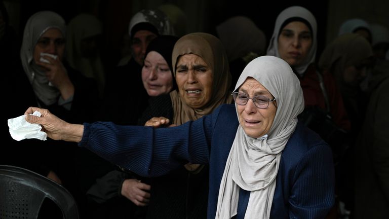 Mourners cry at Ahmad Nimer Al-Shaib's funeral. Pic: AP