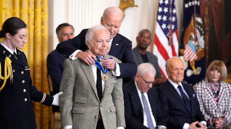 President Joe Biden presents the Presidential Medal of Freedom to fashion designer Ralph Lauren. Pic: AP