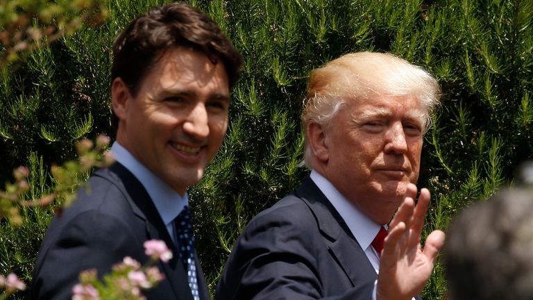 U.S. President Donald Trump and Canadian Prime Minister Justin Trudeau, left, are seen following a family photo of G7 leaders and Outreach partners at the Hotel San Domenico during a G7 summit in Taormina, Italy, Saturday, May 27, 2017. (Jonathan Ernst/Pool photo via AP)