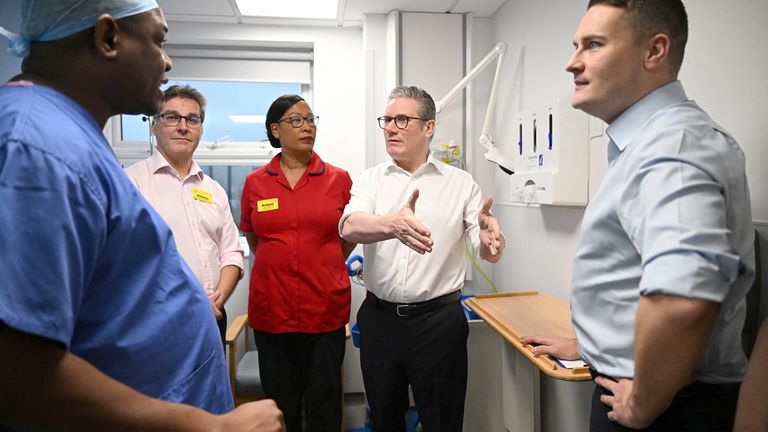 Keir Starmer and Wes Streeting  visits a healthcare provider in Surrey.
Pic: Reuters