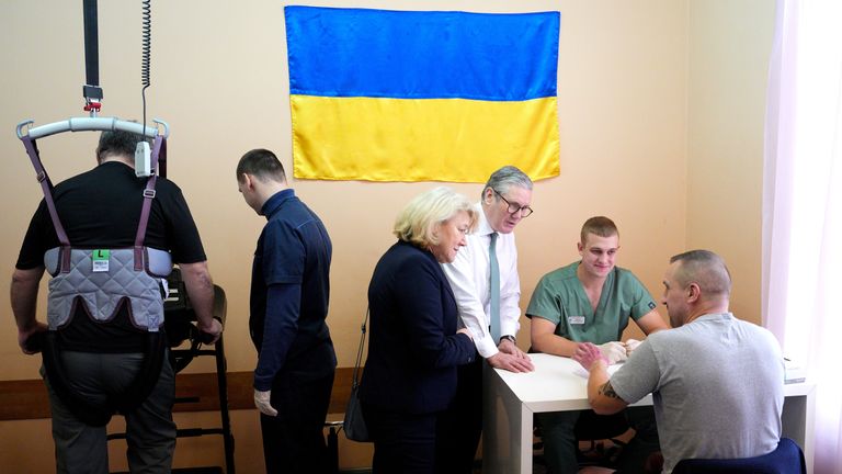 Keir Starmer visits a hospital as a staff member meets with an injured patient, a Ukrainian service member, during his visit to Ukraine.
Pic: PA