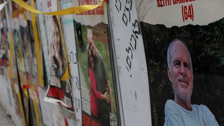 A view of a banner depicting Keith Siegel, who is a dual U.S. citizen seized during the October 7 attack on Israel and taken hostage into Gaza, amid the ongoing conflict between Israel and Hamas, is seen with other images of hostages in Tel Aviv, Israel, April 28, 2024. REUTERS/Shannon Stapleton