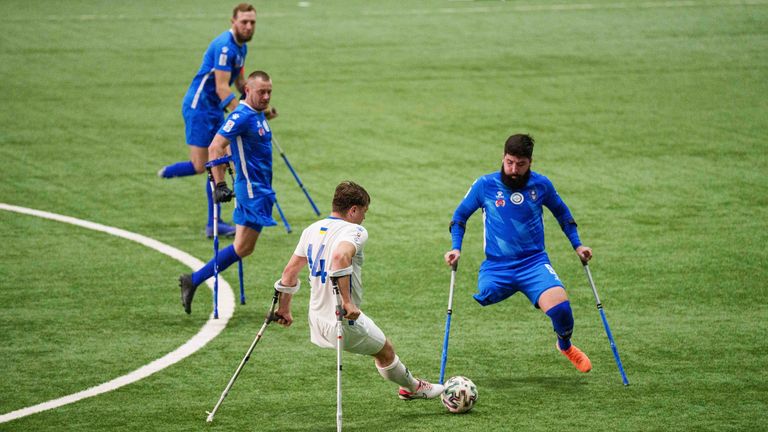 Soccer players of Pokrova FC and Pokrova FC-2 play during the first Ukrainian football tournament for war-wounded amputees in Kyiv, Ukraine, Jan. 11, 2025. (AP Photo/Evgeniy Maloletka)