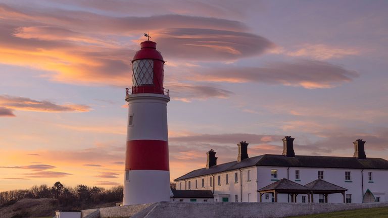 Lenticular clouds spotted over a lighthouse in the northeast of England. Pic: AP