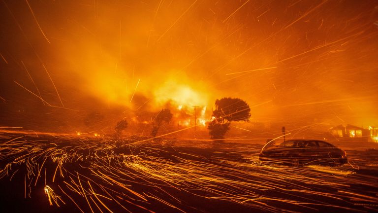 The wind whips up embers from the Palisades fire.
Pic: Reuters/Ringo Chiu