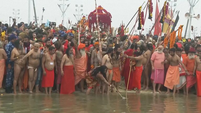 Hindu ascetics and pilgrims take holy dip at Maha Kumbh festival | World News | Sky News