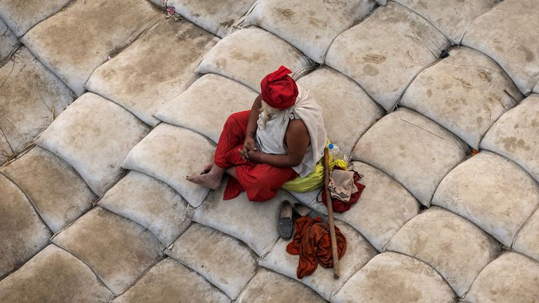 A Sadhu or a Hindu holy man sits on the banks before taking a holy dip at Sangam.
Pic Reuters