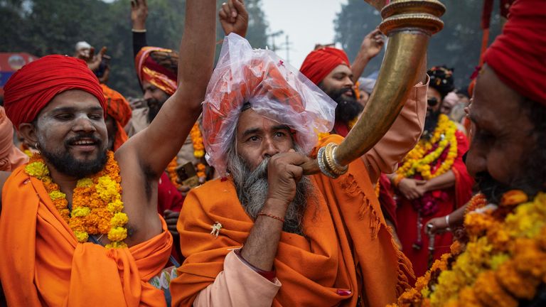 Holy men take part in a religious procession. Pic: Reuters