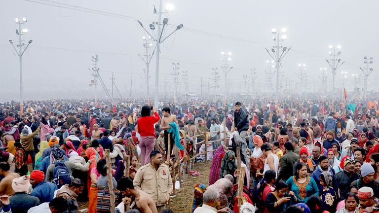 Devotees gather at the "Maha Kumbh Mela", or the Great Pitcher Festival on the day they take a holy dip at Sangam, the confluence of the Ganges and Yamuna rivers with the mythical, invisible Saraswati river, in Prayagraj, India, January 13, 2025. REUTERS/Anushree Fadnavis