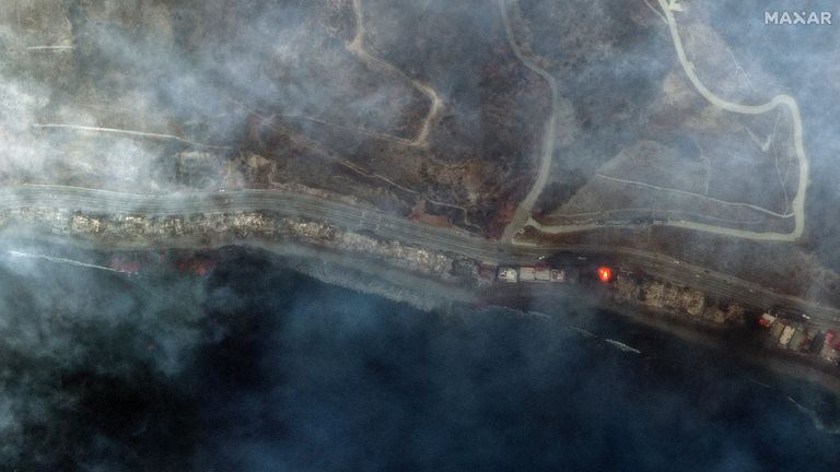 A satellite image shows smoke covering the Pacific Coast Highway along the Malibu coastline.
Pic: Maxar/Reuters