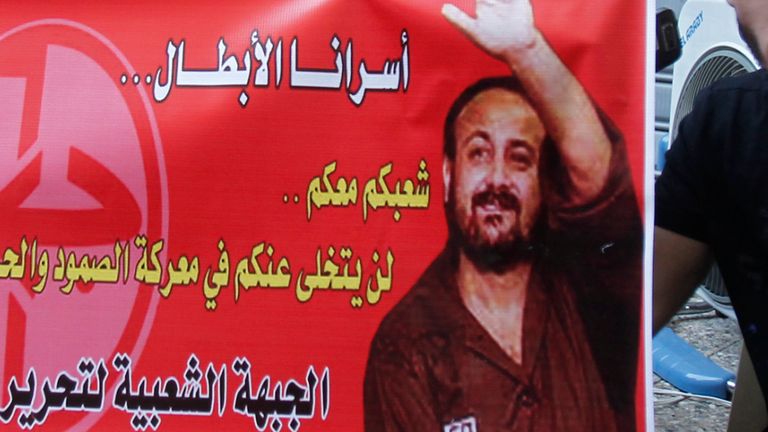 Activists hold a banner depicting jailed Fatah leader Marwan Al-Barghouti in 2011. File pic: Reuters