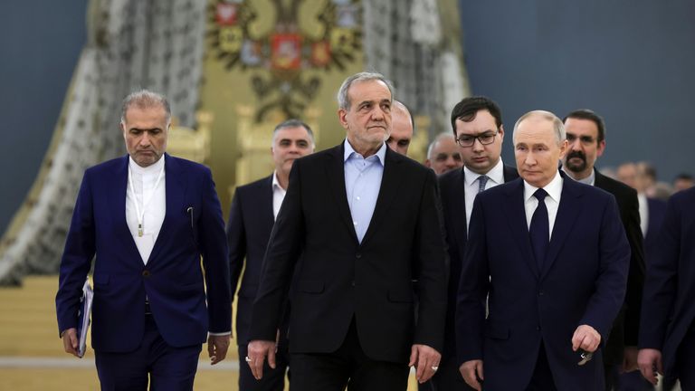 Masoud Pezeshkian (centre) and Vladimir Putin (right).
Pic: AP