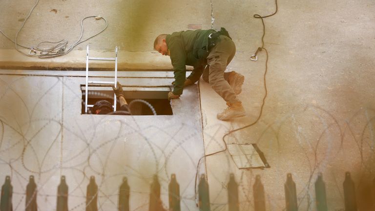 A US Border Patrol agent looks at an illegal tunnel crossing the U.S.-Mexico border. Pic: Reuters