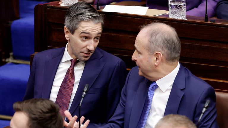 Handout photo issued by Maxwells of Fine Gael leader, Simon Harris TD (left) and Fianna Fail leader, Micheal Martin in the Dail chamber ahead of the vote on the nomination of Mr Martin as Taoiseach. Picture date: Wednesday January 22, 2025. Maxwells/PA