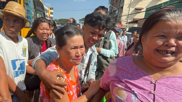 Released prisoners, front center and right, are welcomed by family members and colleagues outside Insein Prison Saturday, Jan. 4, 2025, in Yangon (AP Photo/Thein Zaw)