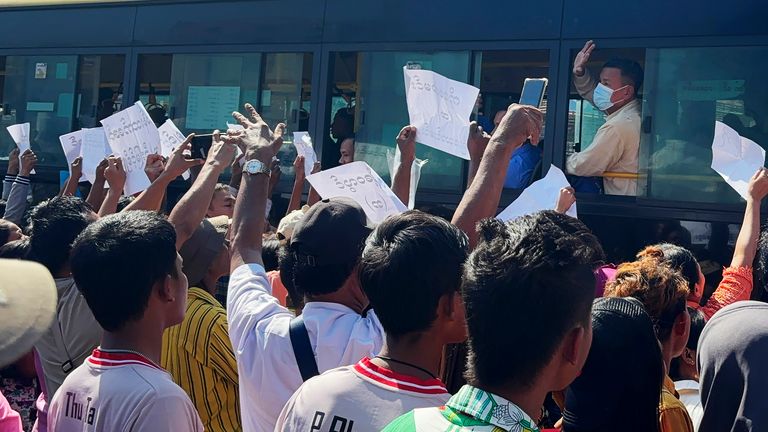 Released prisoners, in a bus, are welcomed by family members and colleagues after they left Insein Prison Saturday, Jan. 4, 2025, in Yangon, Myanmar. (AP Photo/Thein Zaw)