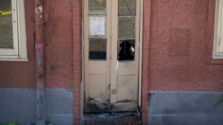 A damaged door on Bourbon Street after a suspicious package was detonated. Pic: AP