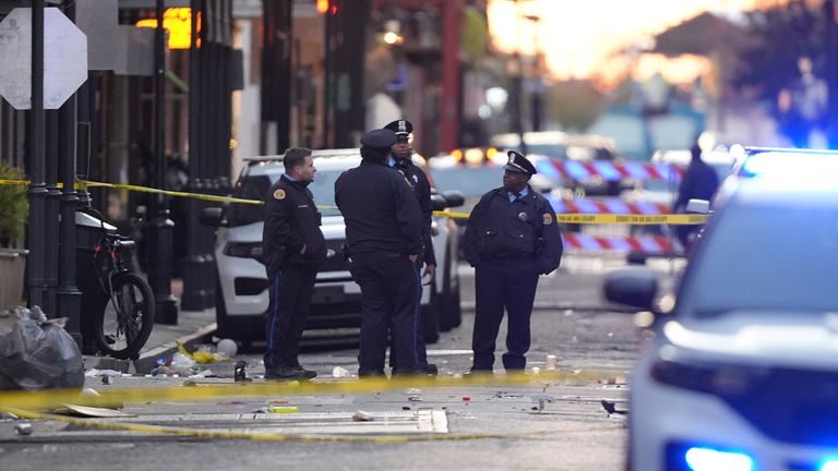 Emergency services attend the scene on Bourbon Street after a vehicle drove into a crowd on New Orleans' Canal and Bourbon Street, Wednesday Jan. 1, 2025. (AP Photo/Gerald Herbert)