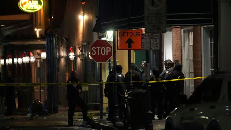 Emergency services attend the scene after a vehicle drove into a crowd on New Orleans' Canal and Bourbon Street, Wednesday Jan. 1, 2025. (AP Photo/Gerald Herbert)