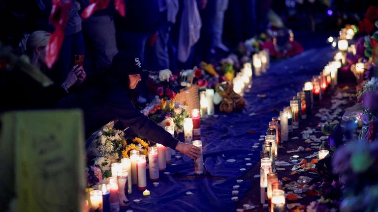 A mourner places a candle at a vigil, after people were killed by a U.S. Army veteran who drove a truck into a crowd celebrating New Year's Day, in New Orleans, Louisiana, U.S. January 4, 2025. REUTERS/Eduardo Munoz