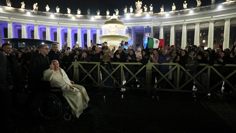 Pope Francis waves faithfuls after celebrating over New Year's Eve Vespers and Te Deum, in St.Peter's Basilica at the Vatican, Tuesday, Dec. 31, 2024. (AP Photo/Andrew Medichini)