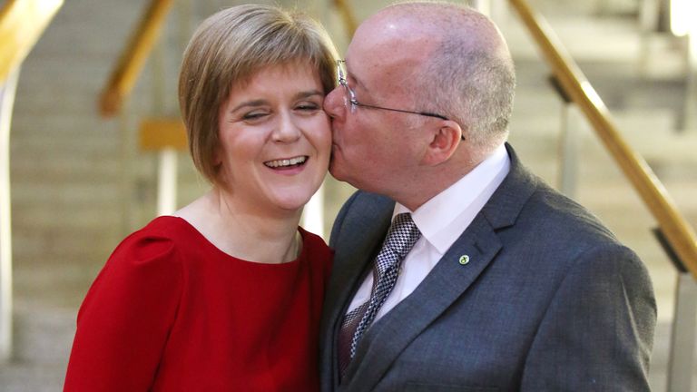 File photo dated 19/11/14 of the then SNP leader Nicola Sturgeon is given a kiss by her husband Peter Murrell at the Scottish Parliament in Edinburgh, after she was voted in as First Minister of Scotland. Former first minister of Scotland Nicola Sturgeon and former SNP chief executive Peter Murrell have "decided to end" their marriage, she said in a post on social media. Issue date: Monday January 13, 2025.