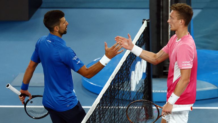 Tennis - Australian Open - Melbourne Park, Melbourne, Australia - January 19, 2025 Serbia's Novak Djokovic shakes hands with Czech Republic's Jiri Lehecka after winning his fourth round match REUTERS/Edgar Su