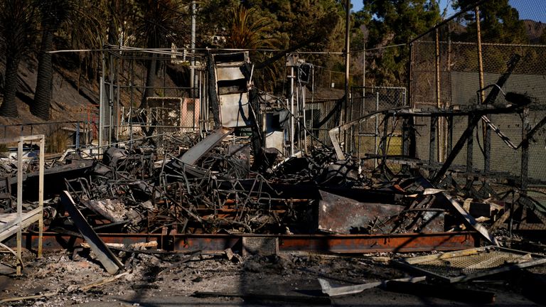 Buildings near athletic fields are burned at Palisades High School in the aftermath of the Palisades Fire in the Pacific Palisades neighborhood of Los Angeles, Tuesday, Jan. 14, 2025. (AP Photo/Carolyn Kaster)