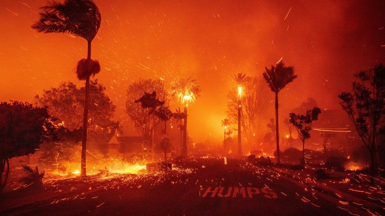 The Palisades Fire wreaks havoc amid strong winds in Pacific Palisades neighborhood of Los Angeles, Tuesday, Jan. 7, 2025. (AP Photo/Ethan Swope)