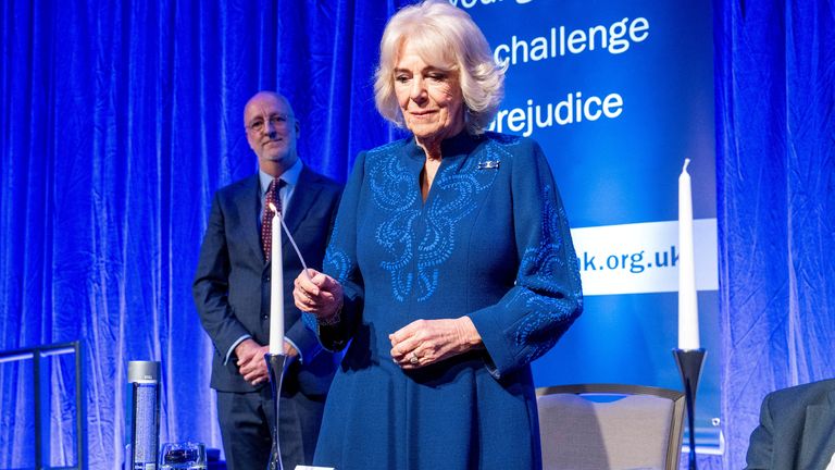 Queen Camilla lights candles during a reception for Holocaust Memorial Day at the Hilton Park Lane. Pic: Reuters